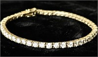 Gold over sterling silver tennis bracelet