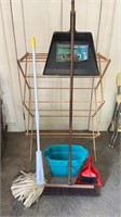 Wooden clothes wrack, mop and bucket, brooms