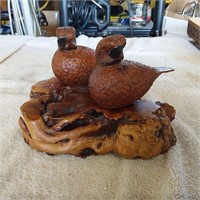 Wood carved birds on wood stand