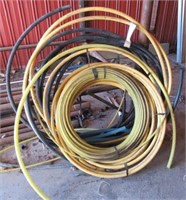 Assortment of various size plastic piping.