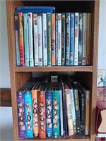 2 shelves of assorted DVDs