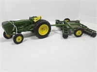 John Deere tractor with cultivator attachment toy