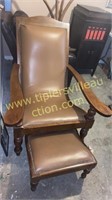 Curved wood chair and ottoman with brass tacks