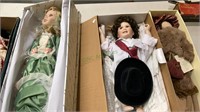3 collector dolls in the boxes - a boy dressed in
