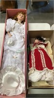 Two collector porcelain dolls in the boxes - one
