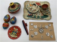 tin child's dishes, top, kazoo and eggs