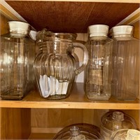 4 large glass Juice jars, glass pitcher.