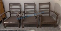 Three brown painted patio chairs