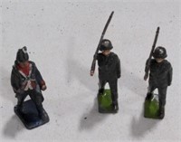 (AB) Trio of vintage metal toy soldiers