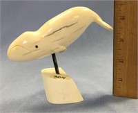 Fossilized ivory carving of a bowhead whale, 5 1/2