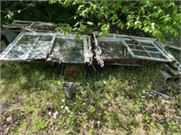 Metal trailer frame with old window frames and