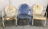 Set of three metal shell back patio chairs