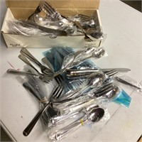 Large box of stainless flatware