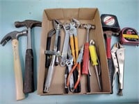 Hammers, tape measure, pliers, adjustable  wrench