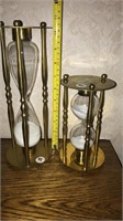 Round brass framed hourglasses