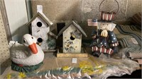 Two wooden bird houses, resin duck, metal candle