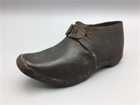 Early wooden and leather child shoe;