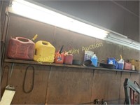 SHELF OF USED GAS CANS