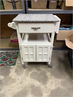 Kitchen cart on wheels with solid surface top