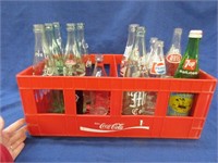 14 coca-cola-pepsi-other bottles in plastic crate