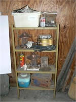 Contents of metal shelf: bird feeders, vintage