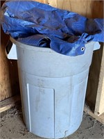 Tarp and trash can