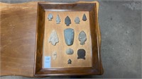 Frame display of arrowheads and fossil