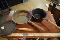 Four Wooden Handle Cast iron Skillets