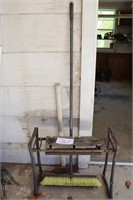 splitting maul, broom and stool