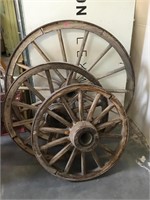 3 antique wood wagon wheels, various sizes