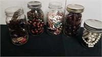 Five jars with assorted jewelry