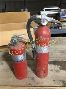 2 red fire extinguishers