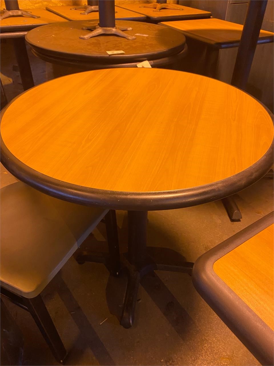 One 30" round pecan table standard height