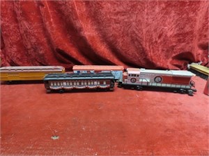 Lionel engine & 3 rolling stock cars.