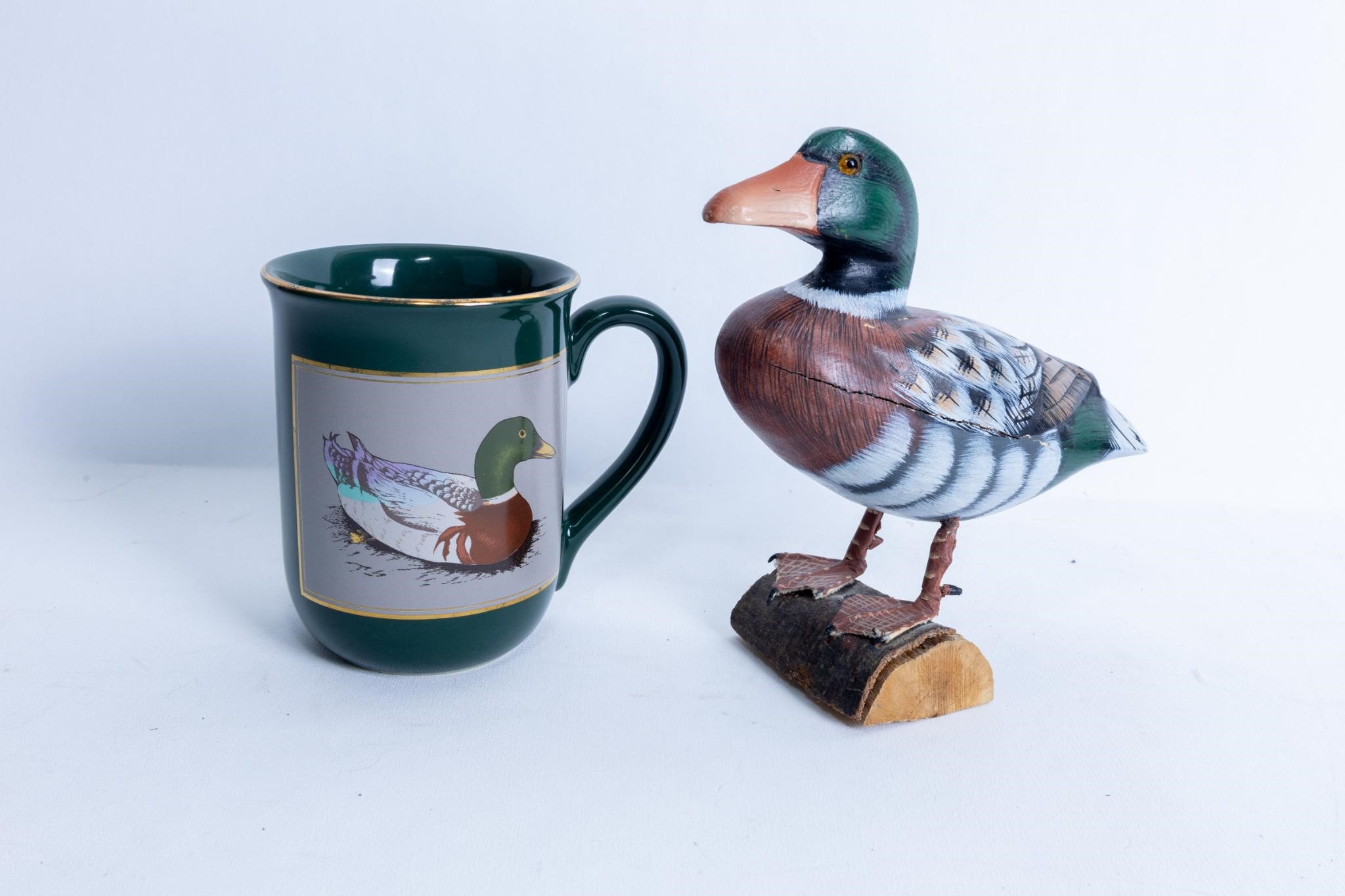 Carved duck figure & mug