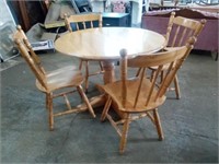Pedestal Round Wooden Table has 4 Chairs- 1 is a