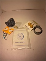 lot of jewelry and jewelry cleaning plate
