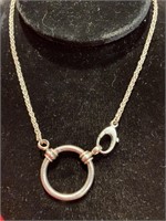 Necklace with a 20” chain. Connects in front at
