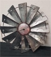 Metal windmill clock looks like it's missing one