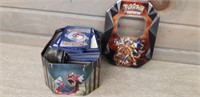 Tin of assorted Pokemon cards + more