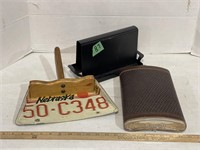 Custom-made dustpan, large leather flask, and