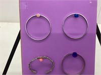 Four  bangle bracelets