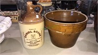 Daniel Boone whiskey jug in a stoneware planter,