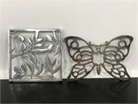 Pair of metal floral and butterfly trivets