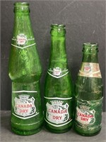 Trio of vintage Canada Dry bottles. Different
