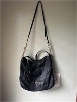 Michael Kors black leather purse with tassel has