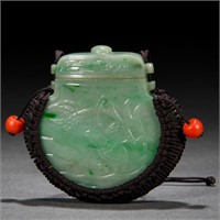 A CHINESE CARVED JADEITE POUCH