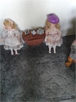 TWO PORCELAIN DOLLS & TABLE & 2 CHAIRS & TEA SET