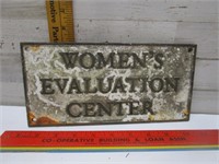 CAST IRON WOMEN'S EVALUATION CENTER SIGN