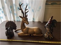 Deer, turkey, rooster statues